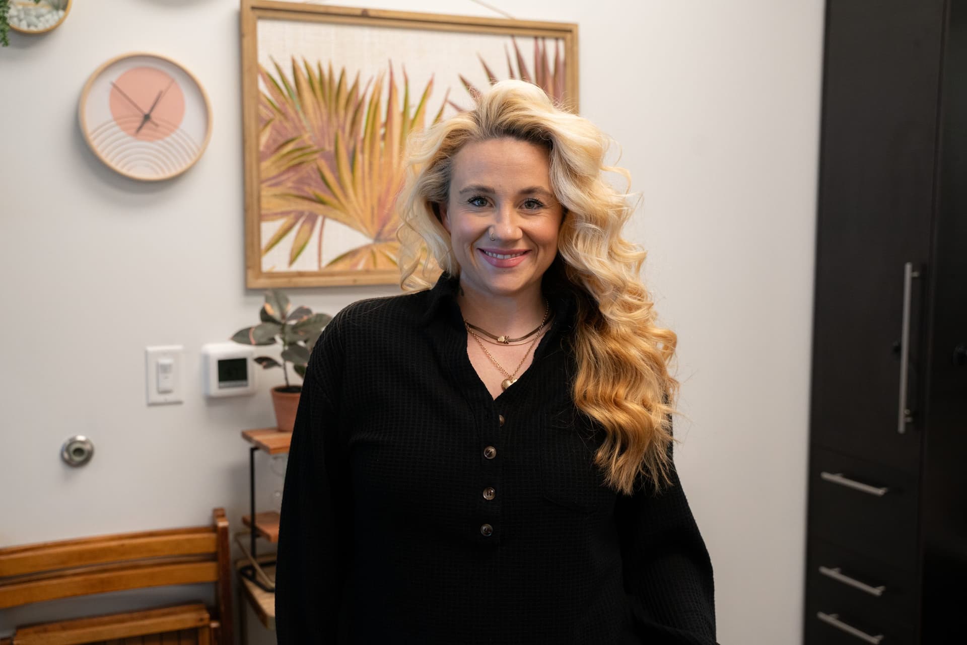 Beauty professional working in a salon suite at The Hive Salon Studios in Florence, KY.